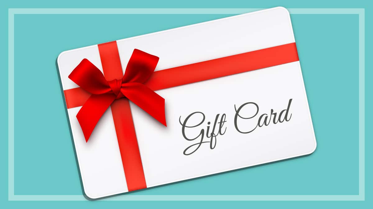 Gift card with a red bow ad blue background